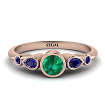 bezel_symmetrical_Emerald_Ring_2.jpg