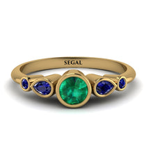 bezel_symmetrical_Emerald_Ring_2.jpg