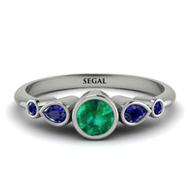bezel_symmetrical_Emerald_Ring_2.jpg