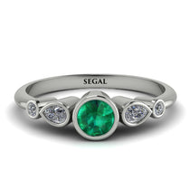 bezel_symmetrical_emerald_ring_2.jpg