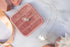 Wisteria — Gold name necklace styled flat lay